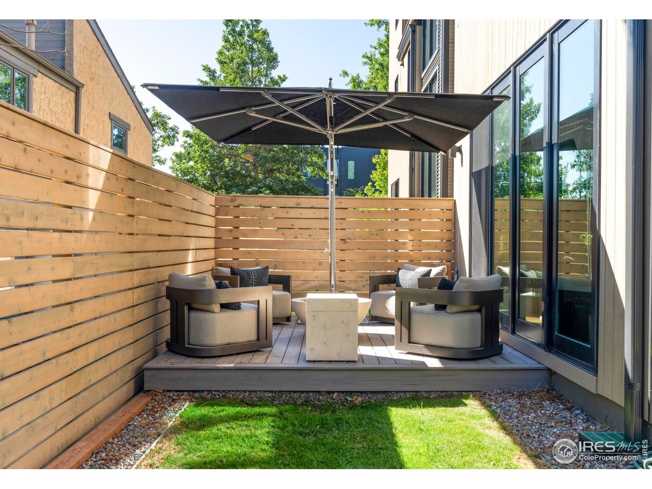 2709 Pine Street Boulder, CO 80302 - Photo 27 of 32 a view of a patio with table and chairs under an umbrella