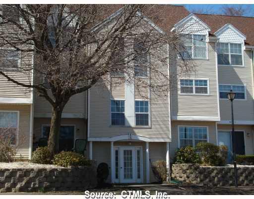 2390 State Street, Unit 2E Hamden, CT 06517 - Photo 1 of 1 a view of a yard in front of a house