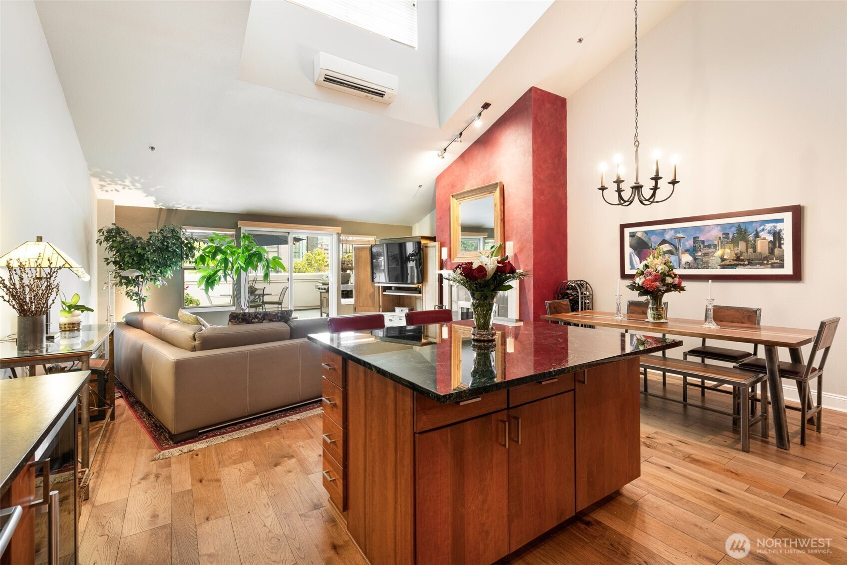 526 1st Avenue South, Unit 511 Seattle, WA 98104 - Photo 13 of 36 a living room with furniture a dining table and a large window