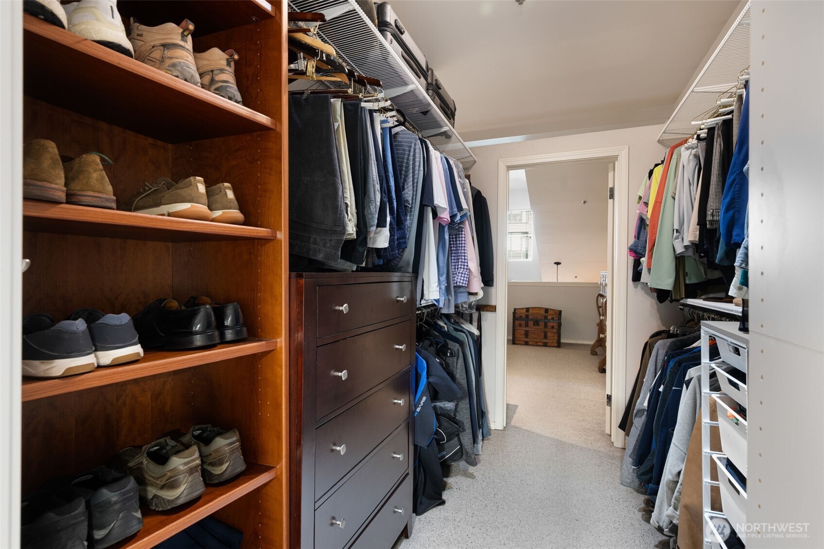 526 1st Avenue South, Unit 511 Seattle, WA 98104 - Photo 25 of 36 a view of walk in closet with clothes and shoes