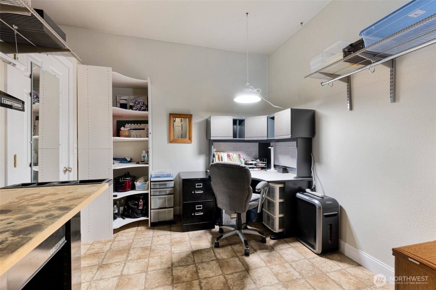 526 1st Avenue South, Unit 511 Seattle, WA 98104 - Photo 26 of 36 a view of a workspace with furniture and a window