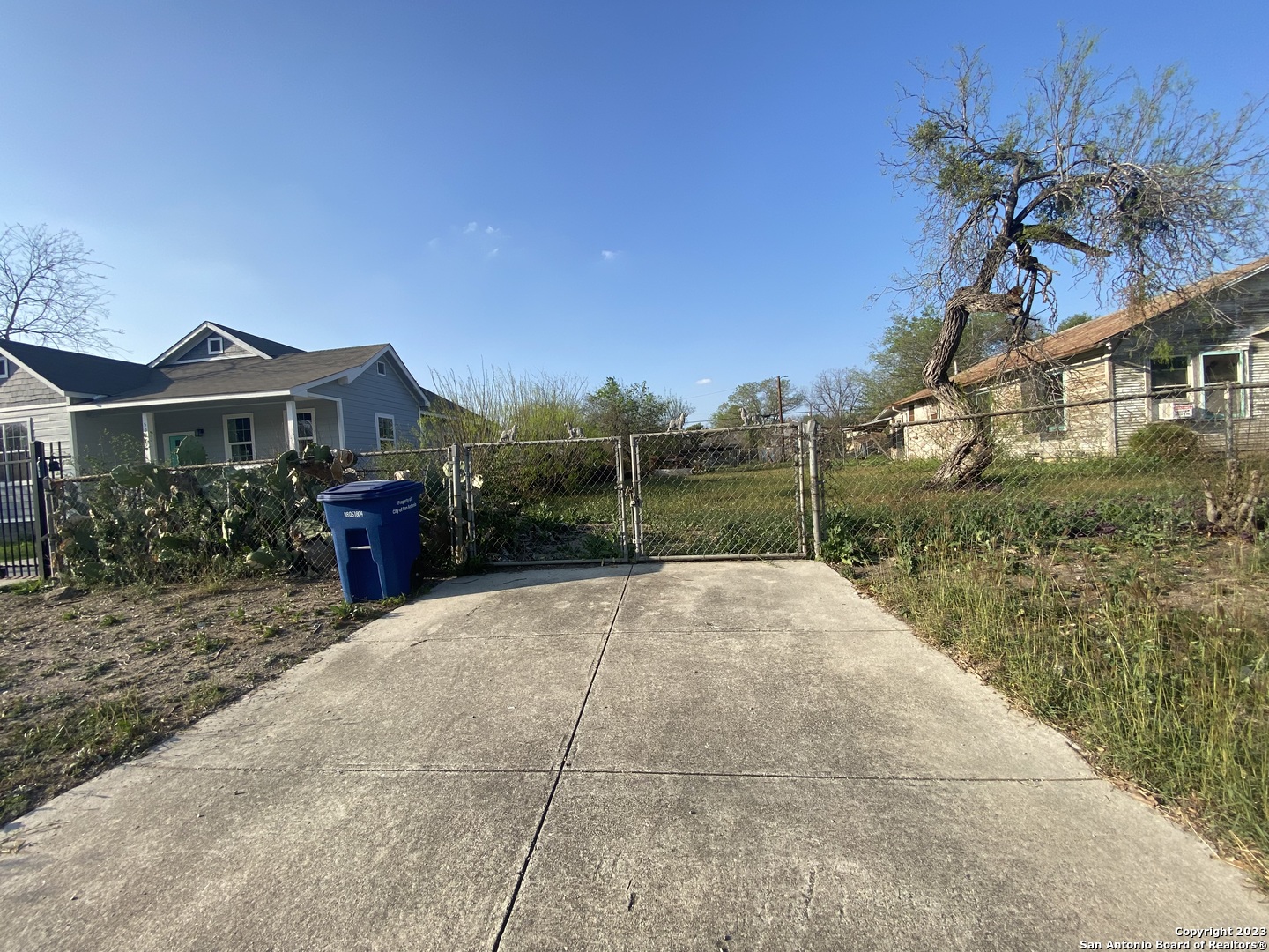 Lot 34-35 Westfall Avenue San Antonio, TX 78210 - Photo 1 of 9 a view of a house with a yard and potted plants