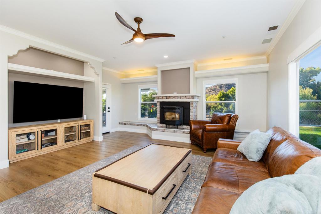 22544 Tombill Road Ramona, CA 92065 - Photo 11 of 74 a living room with furniture and a flat screen tv
