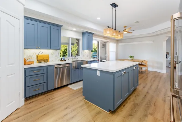 a spacious bedroom with a bed a couch and a window