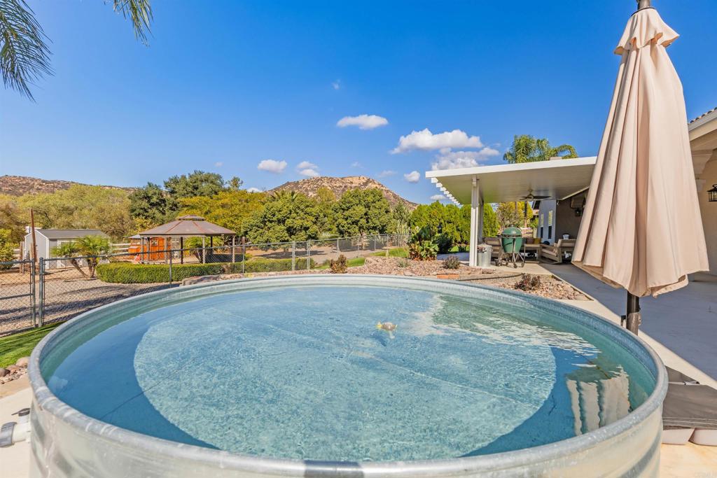 22544 Tombill Road Ramona, CA 92065 - Photo 23 of 74 a view of a swimming pool with an outdoor seating