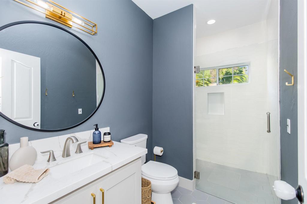 22544 Tombill Road Ramona, CA 92065 - Photo 25 of 74 a bathroom with a toilet a sink and mirror