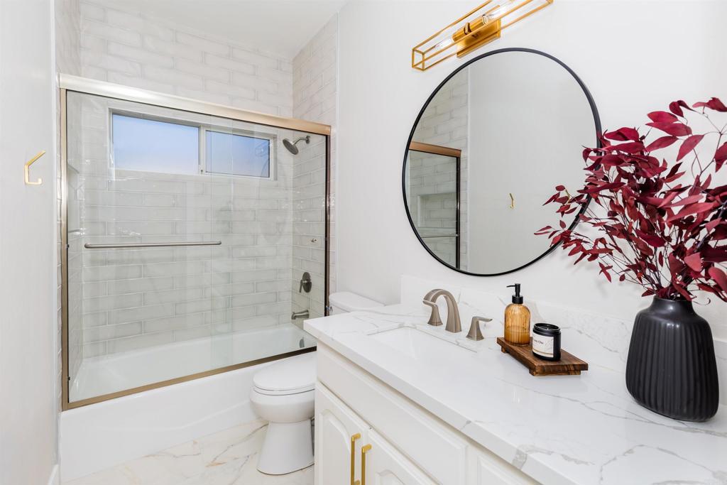 22544 Tombill Road Ramona, CA 92065 - Photo 27 of 74 a bathroom with a sink a toilet and a mirror