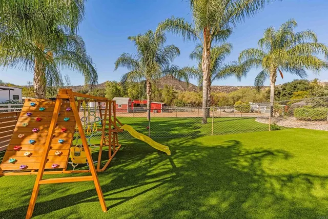 a view of a house with backyard porch and sitting area