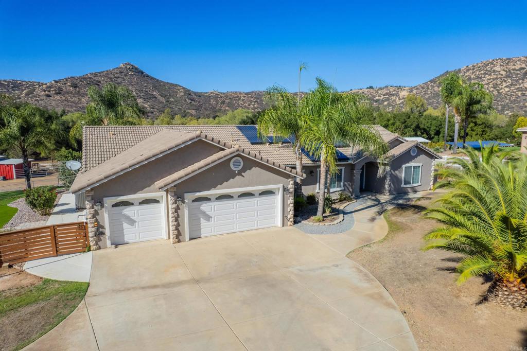 22544 Tombill Road Ramona, CA 92065 - Photo 3 of 74 a view of a house with a yard and mountain view
