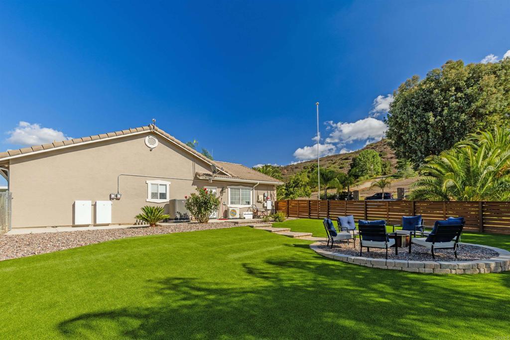 22544 Tombill Road Ramona, CA 92065 - Photo 31 of 74 a view of a house with a yard porch and sitting area