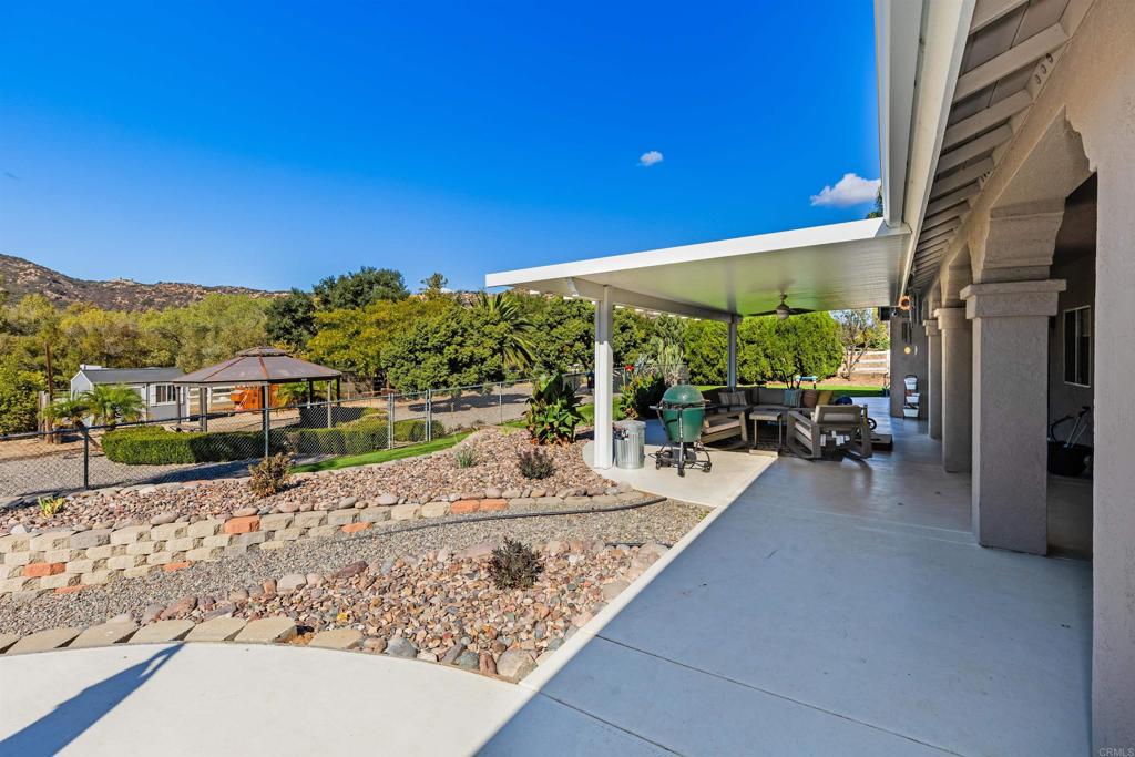 22544 Tombill Road Ramona, CA 92065 - Photo 35 of 74 a view of a house with backyard porch and sitting area