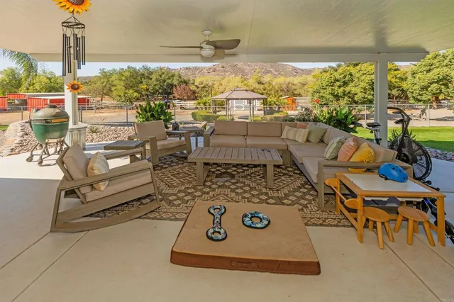 a view of a backyard with sitting area