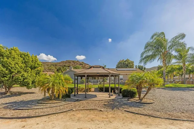 an aerial view of a city and mountain view in back