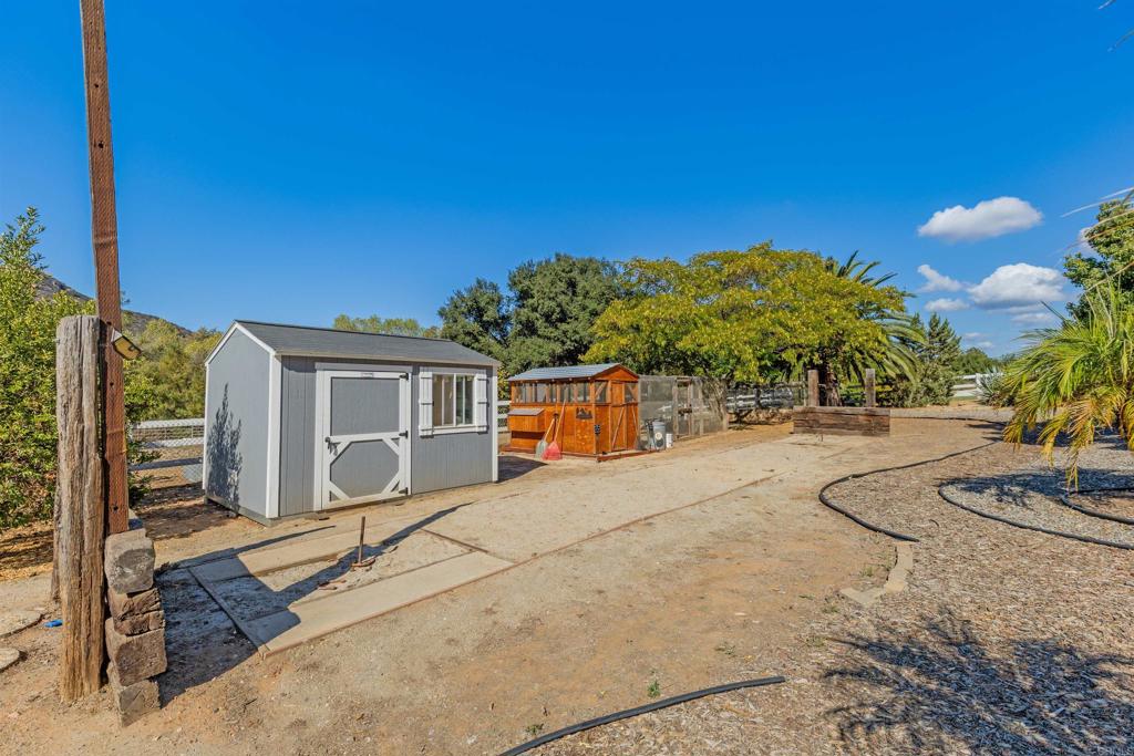22544 Tombill Road Ramona, CA 92065 - Photo 39 of 74 a house with trees in front of it