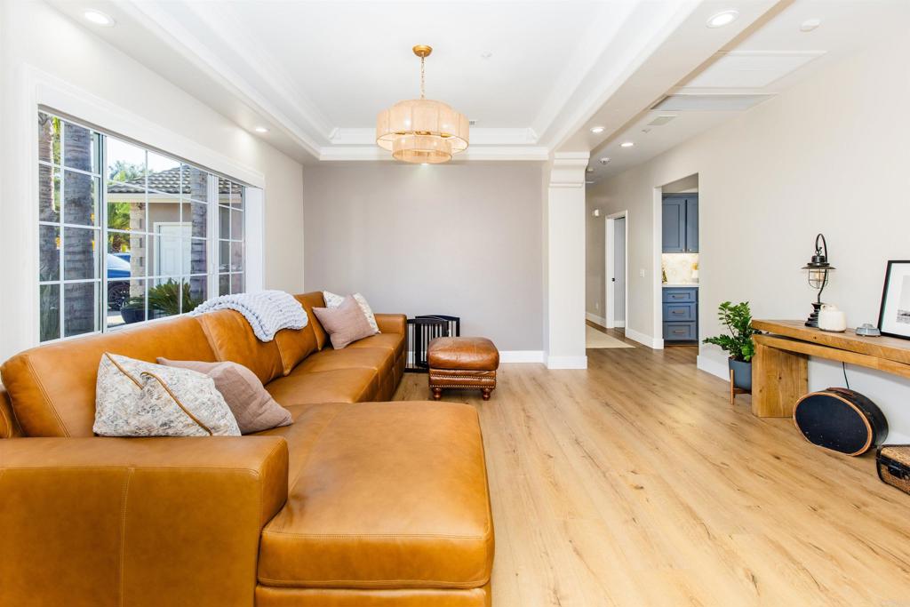 22544 Tombill Road Ramona, CA 92065 - Photo 6 of 74 a bedroom with a bed and wooden floor