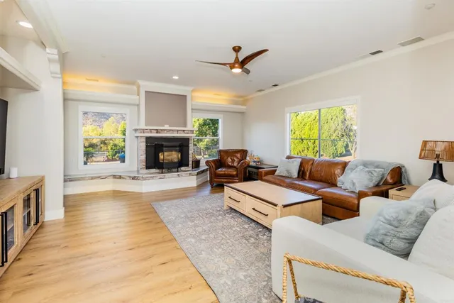 a living room with furniture rug and window
