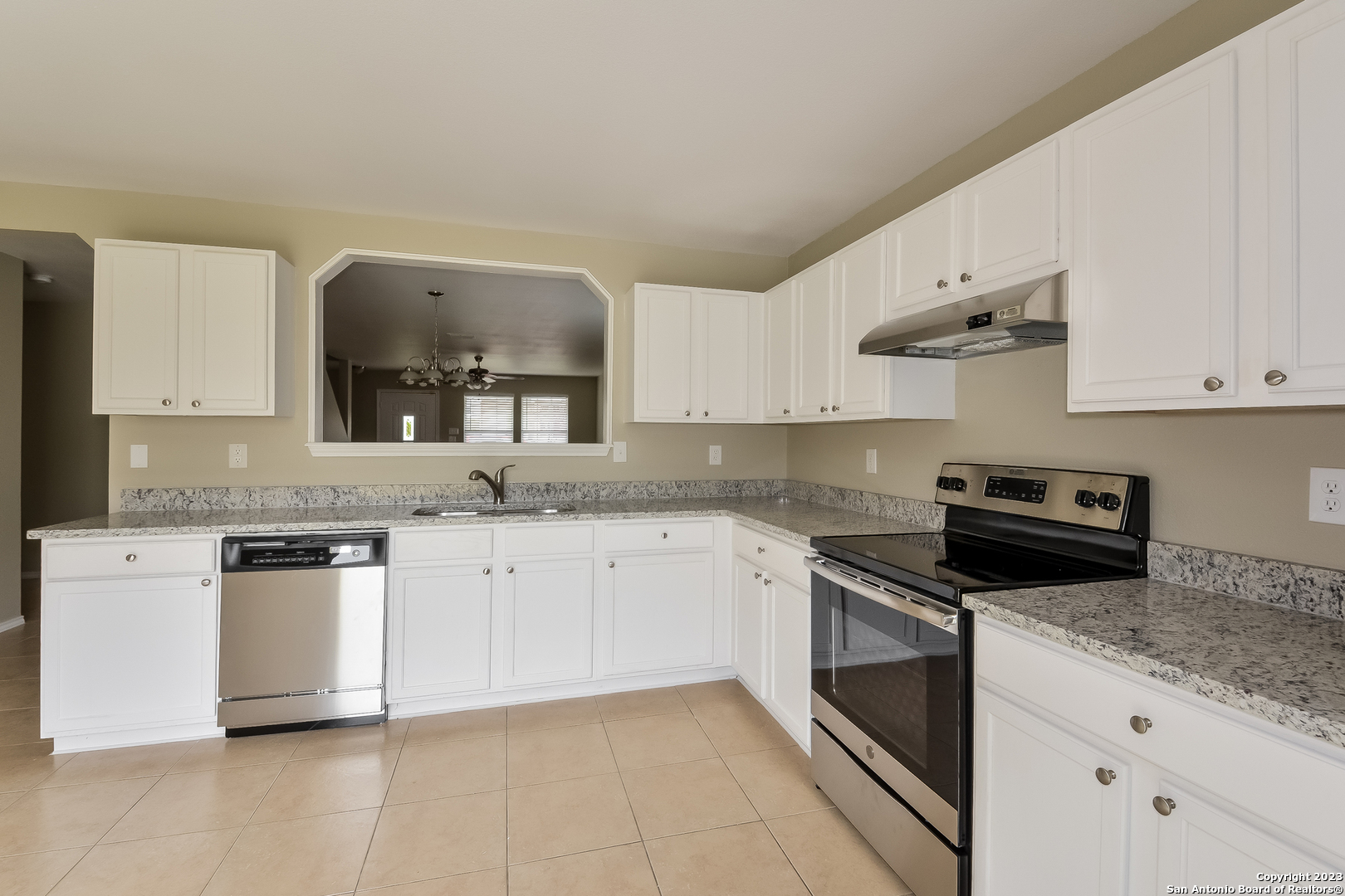 315 Mallow Grove San Antonio, TX 78253 - Photo 5 of 15 a kitchen with stainless steel appliances granite countertop a sink and a stove