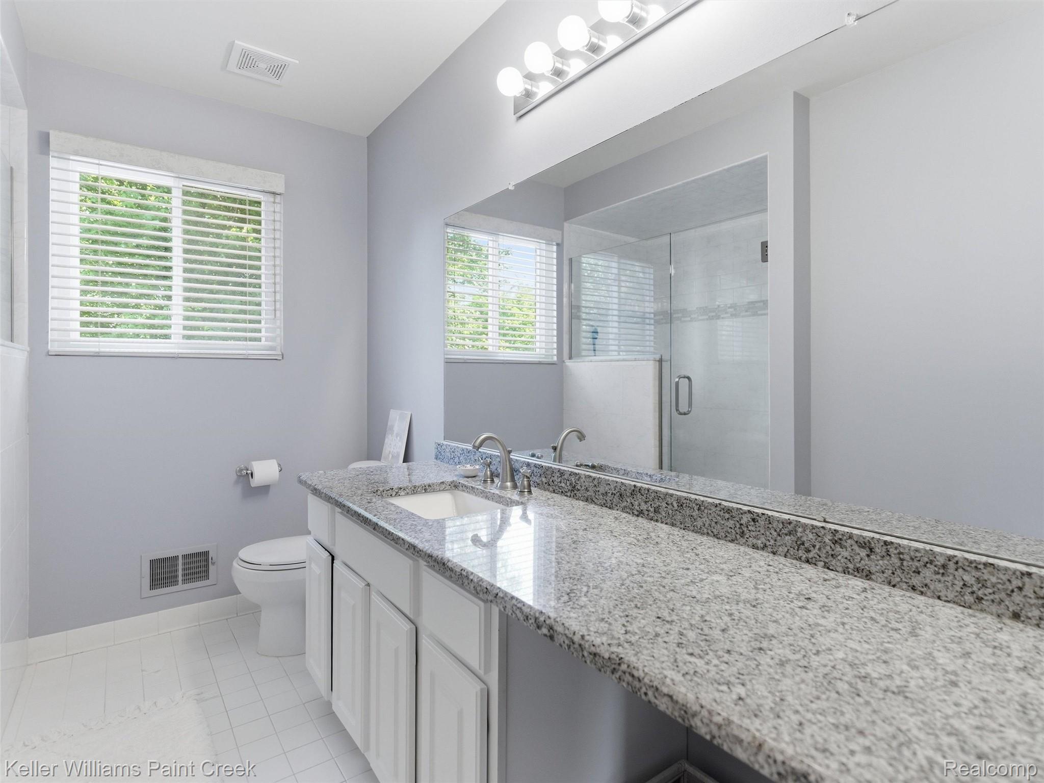 2842 Manorwood Road Troy, MI 48085 - Photo 55 of 72 Double vanity with granite countertop and integrated sinks
