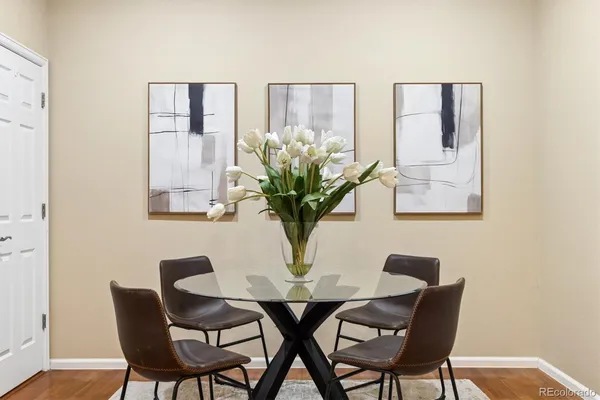 a view of a dining room with furniture and wooden floor