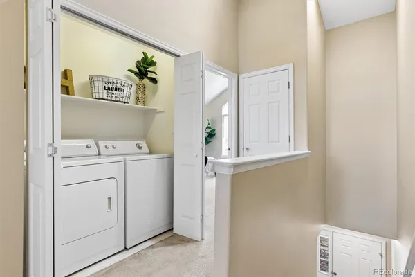 a bedroom with a bed and a table