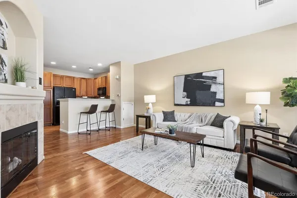 a living room with furniture and a fireplace