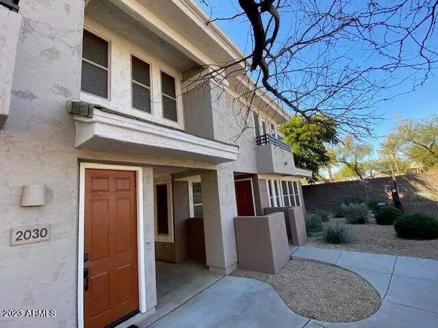 a view of a hallway with wooden floor and closet area