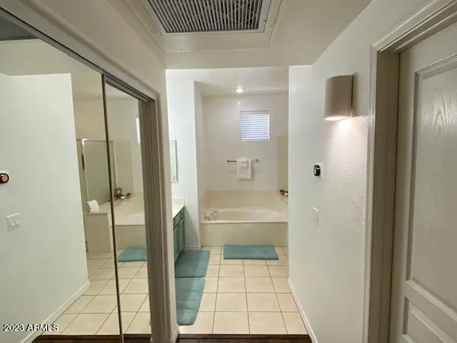 a bathroom with a bathtub and a shower