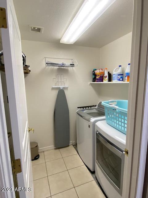 15221 North Clubgate Drive, Unit 2030 Scottsdale, AZ 85254 - Photo 20 of 26 a storage room with washer and dryer