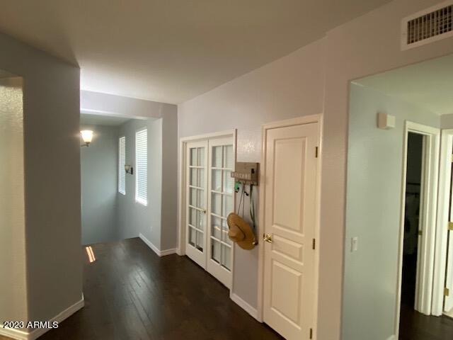 15221 North Clubgate Drive, Unit 2030 Scottsdale, AZ 85254 - Photo 2 of 26 a view of a hallway with wooden floor and closet area