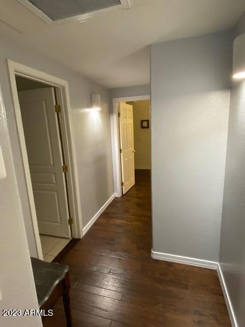 15221 North Clubgate Drive, Unit 2030 Scottsdale, AZ 85254 - Photo 23 of 26 an entryway door with wooden floor