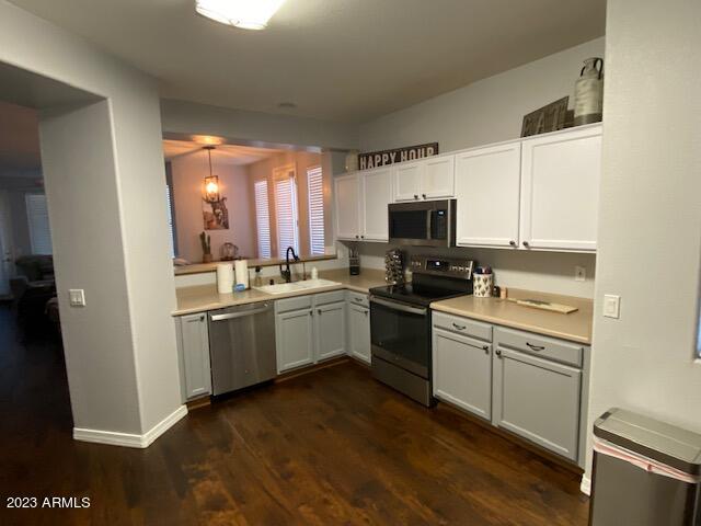 15221 North Clubgate Drive, Unit 2030 Scottsdale, AZ 85254 - Photo 3 of 26 a kitchen with a sink cabinets and stainless steel appliances