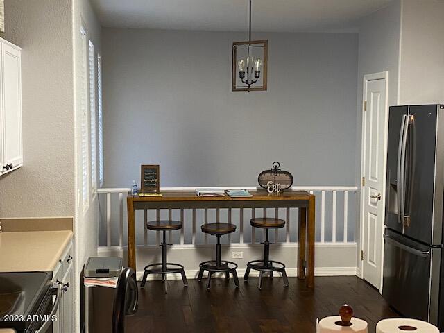 15221 North Clubgate Drive, Unit 2030 Scottsdale, AZ 85254 - Photo 5 of 26 a view of a dining room with furniture window and wooden floor