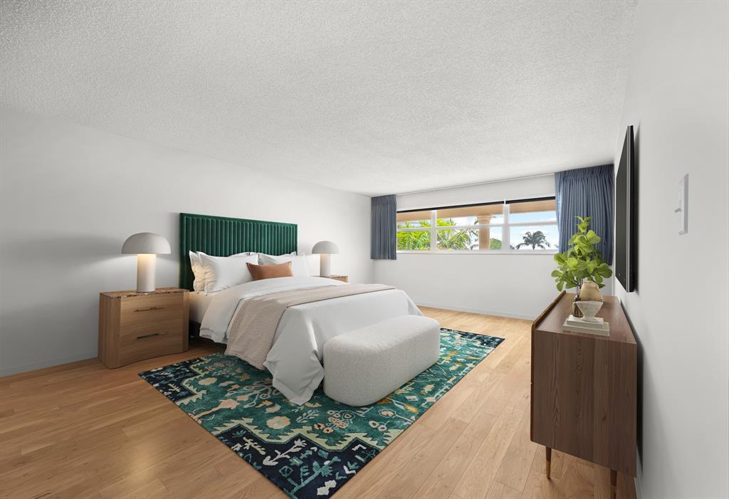 1710 South Ocean Lane, Unit 404 Fort Lauderdale, FL 33316 - Photo 13 of 33 a bedroom with a bed and window