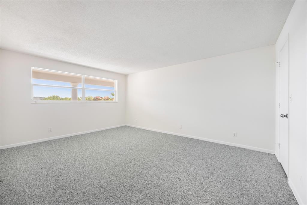 1710 South Ocean Lane, Unit 404 Fort Lauderdale, FL 33316 - Photo 17 of 33 an empty room with a window