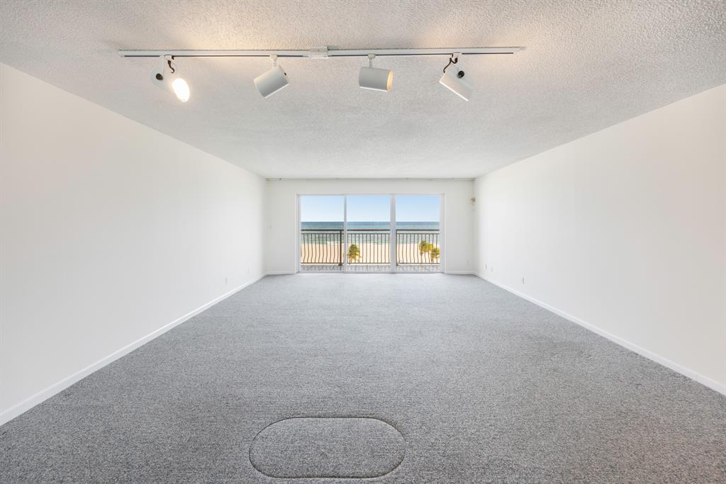 1710 South Ocean Lane, Unit 404 Fort Lauderdale, FL 33316 - Photo 2 of 33 a view of a room with racks on the wall