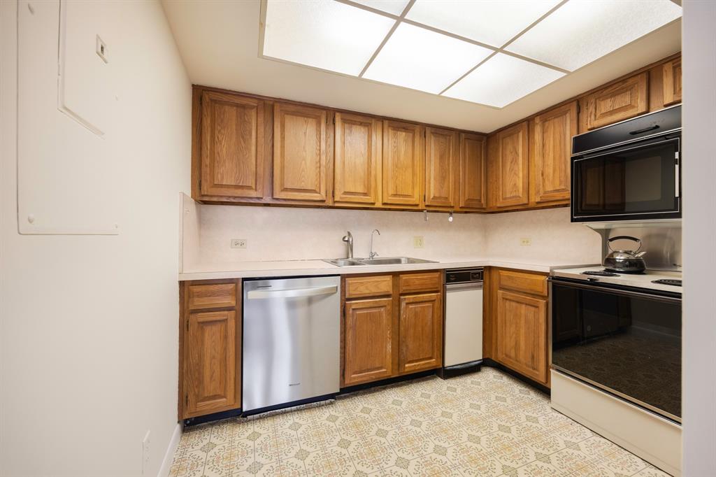 1710 South Ocean Lane, Unit 404 Fort Lauderdale, FL 33316 - Photo 26 of 33 a kitchen with stainless steel appliances granite countertop a stove a sink and a microwave