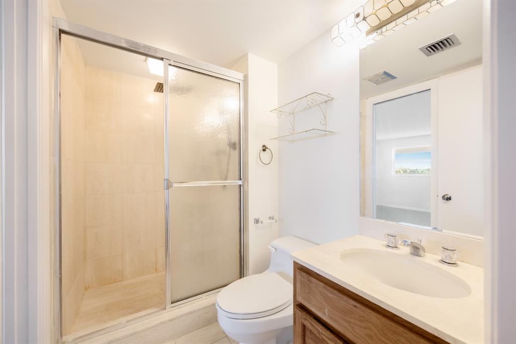 1710 South Ocean Lane, Unit 404 Fort Lauderdale, FL 33316 - Photo 30 of 33 a bathroom with a sink a toilet and shower