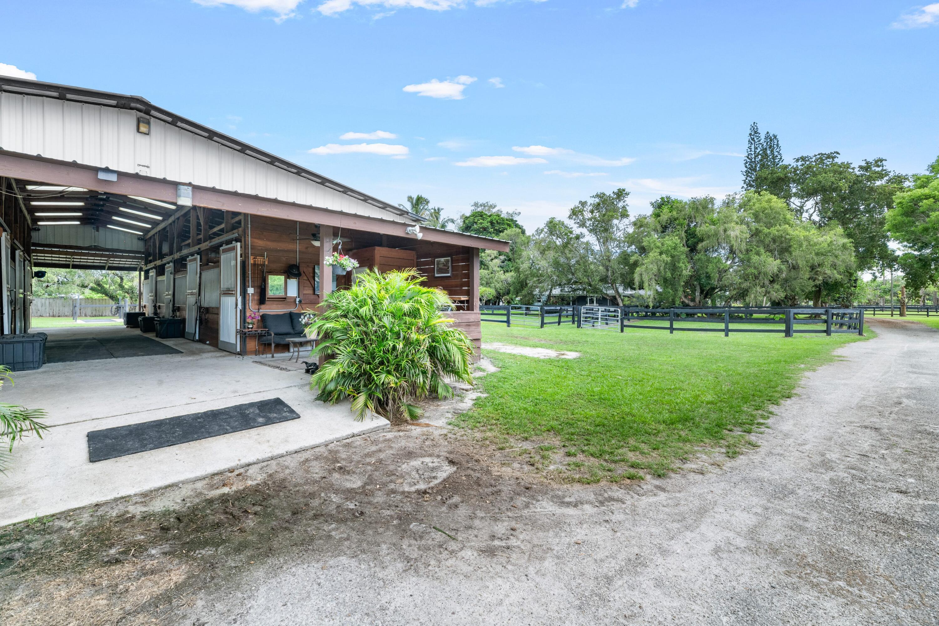 14536 N Road Loxahatchee Groves, FL 33470 - Photo 23 of 79 Center Aisle 7 Stall Barn