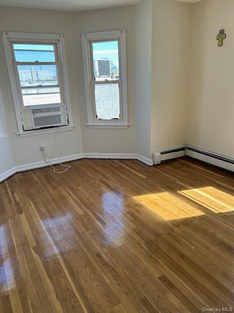 100 Merrick Road Lynbrook, NY 11563 - Photo 3 of 10 a view of an empty room and window