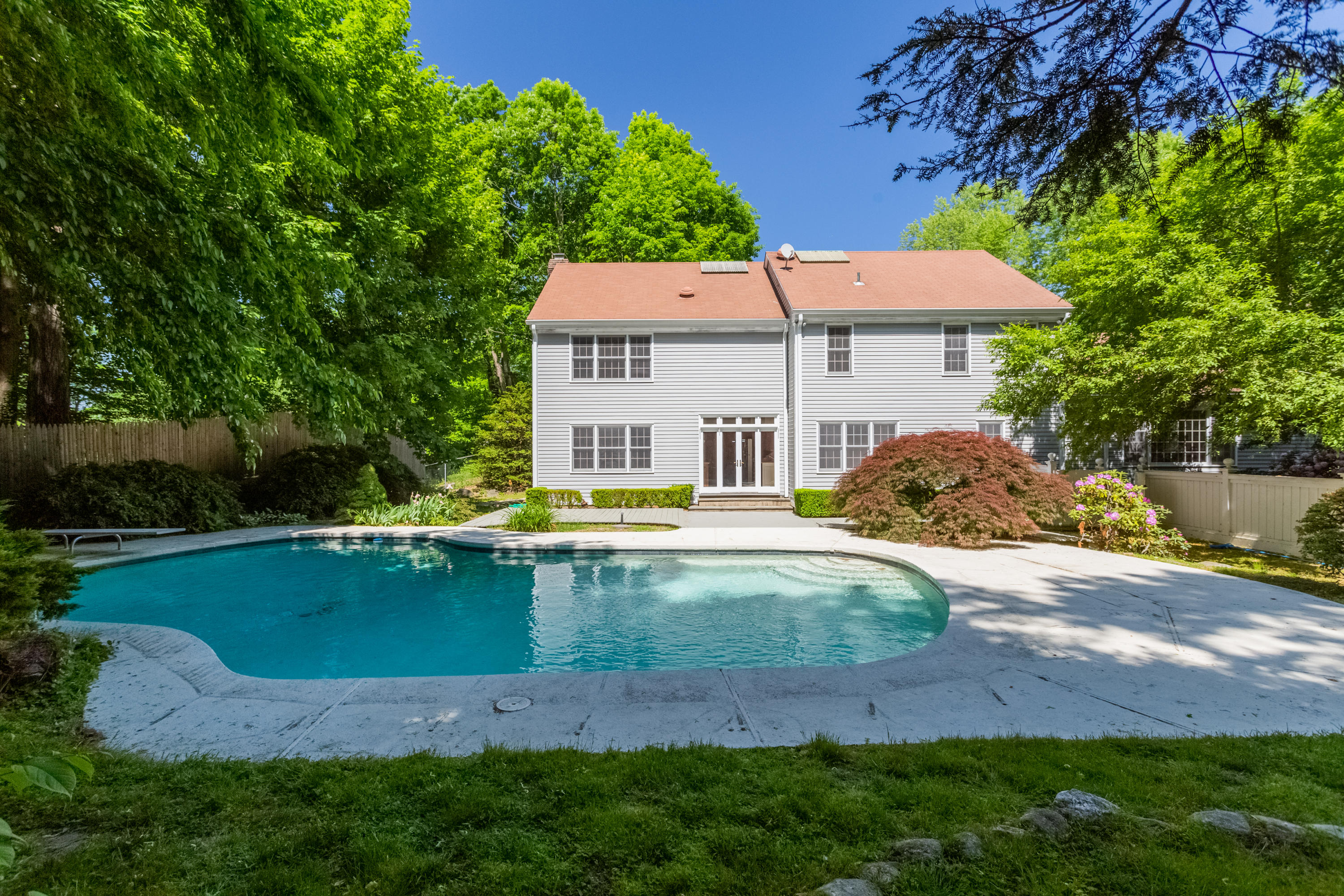 36 Locust Hill Road Darien, CT 06820 - Photo 2 of 40 a view of a house with pool and a yard