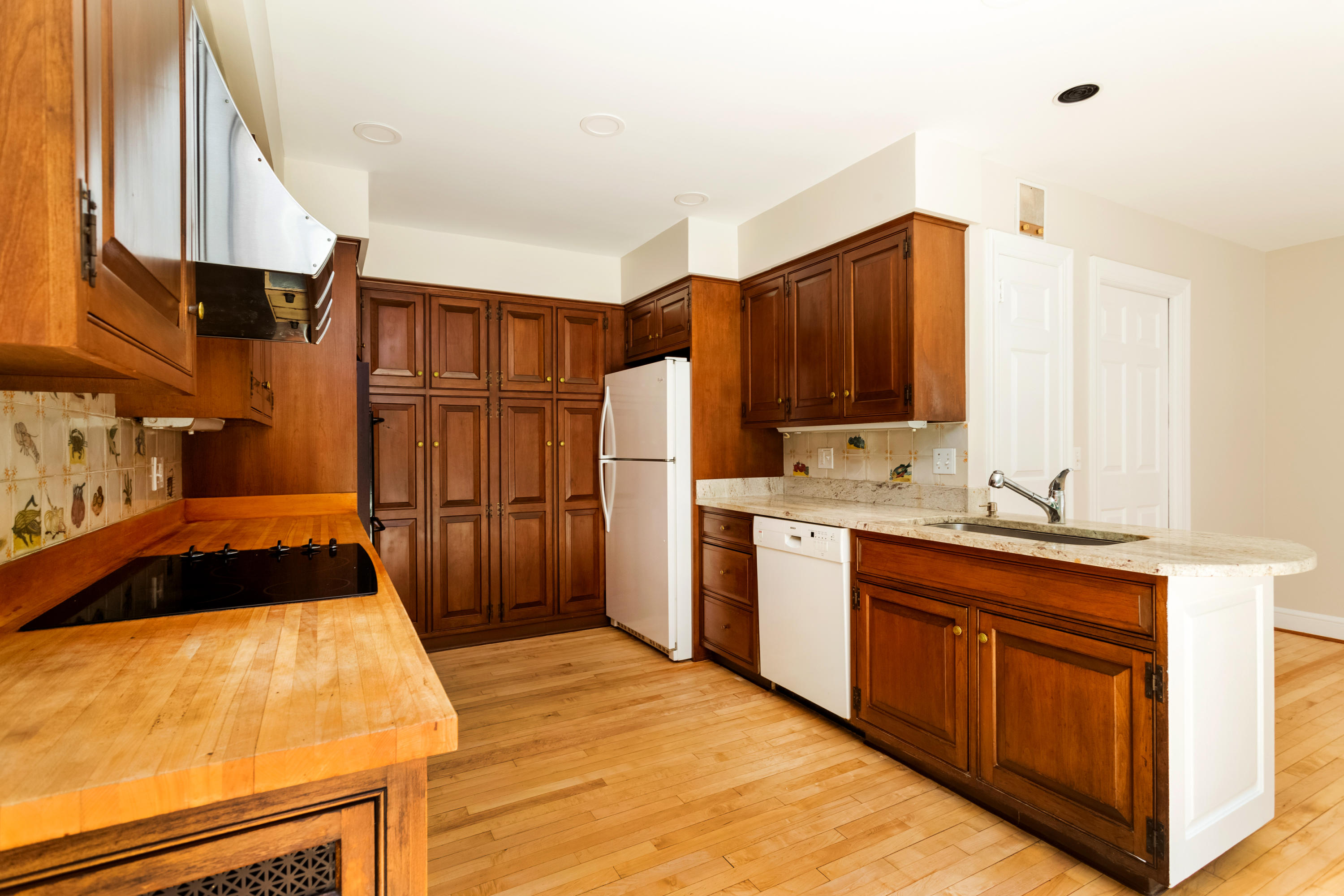 36 Locust Hill Road Darien, CT 06820 - Photo 12 of 40 a kitchen with a sink refrigerator and cabinets
