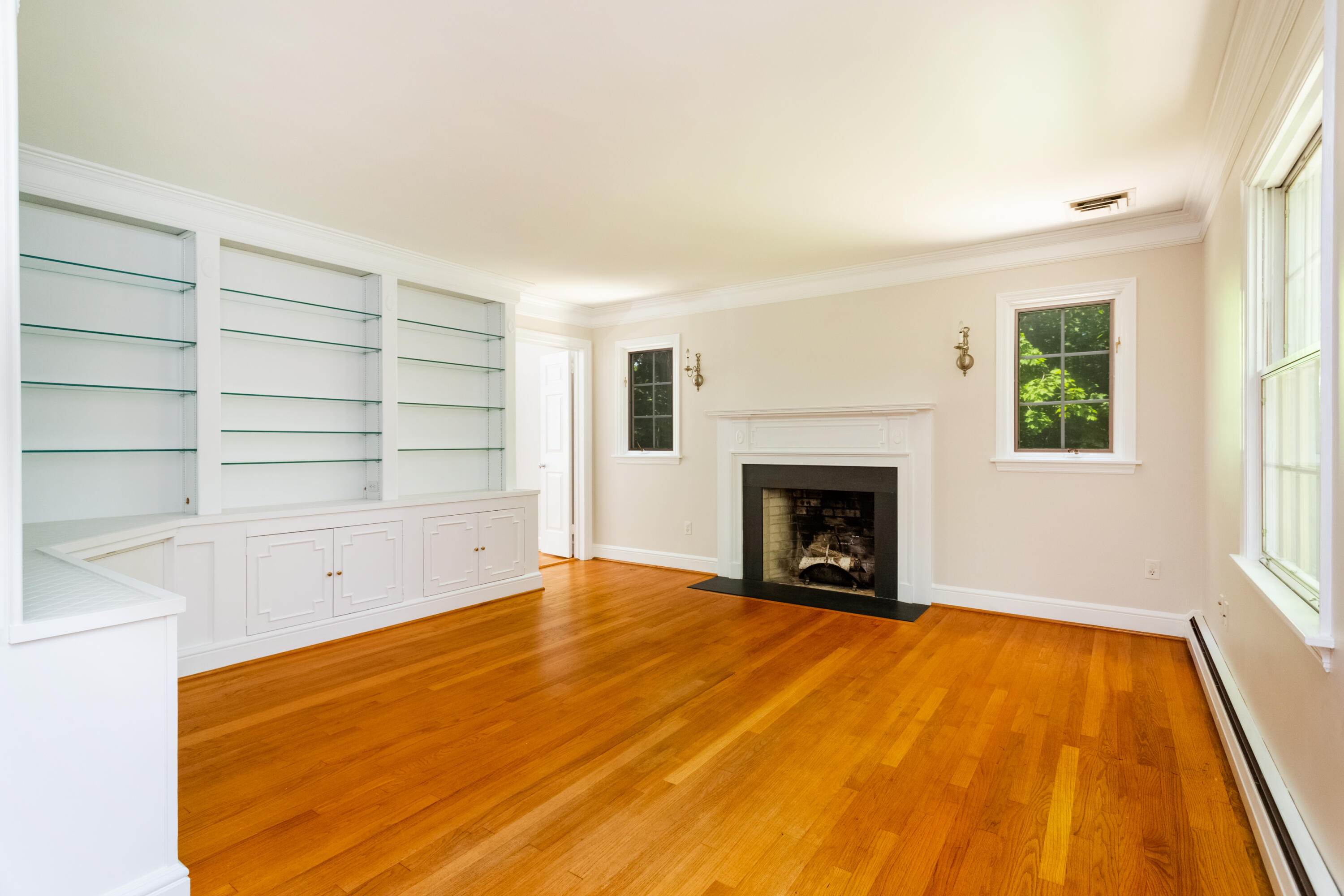 36 Locust Hill Road Darien, CT 06820 - Photo 25 of 40 a view of an empty room with a fireplace and a window