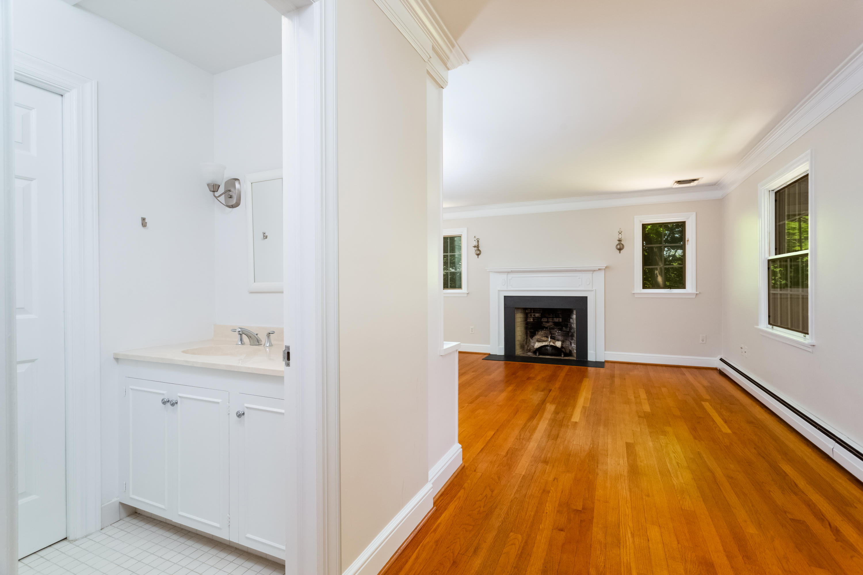 36 Locust Hill Road Darien, CT 06820 - Photo 26 of 40 a view of a room with wooden floor and fireplace