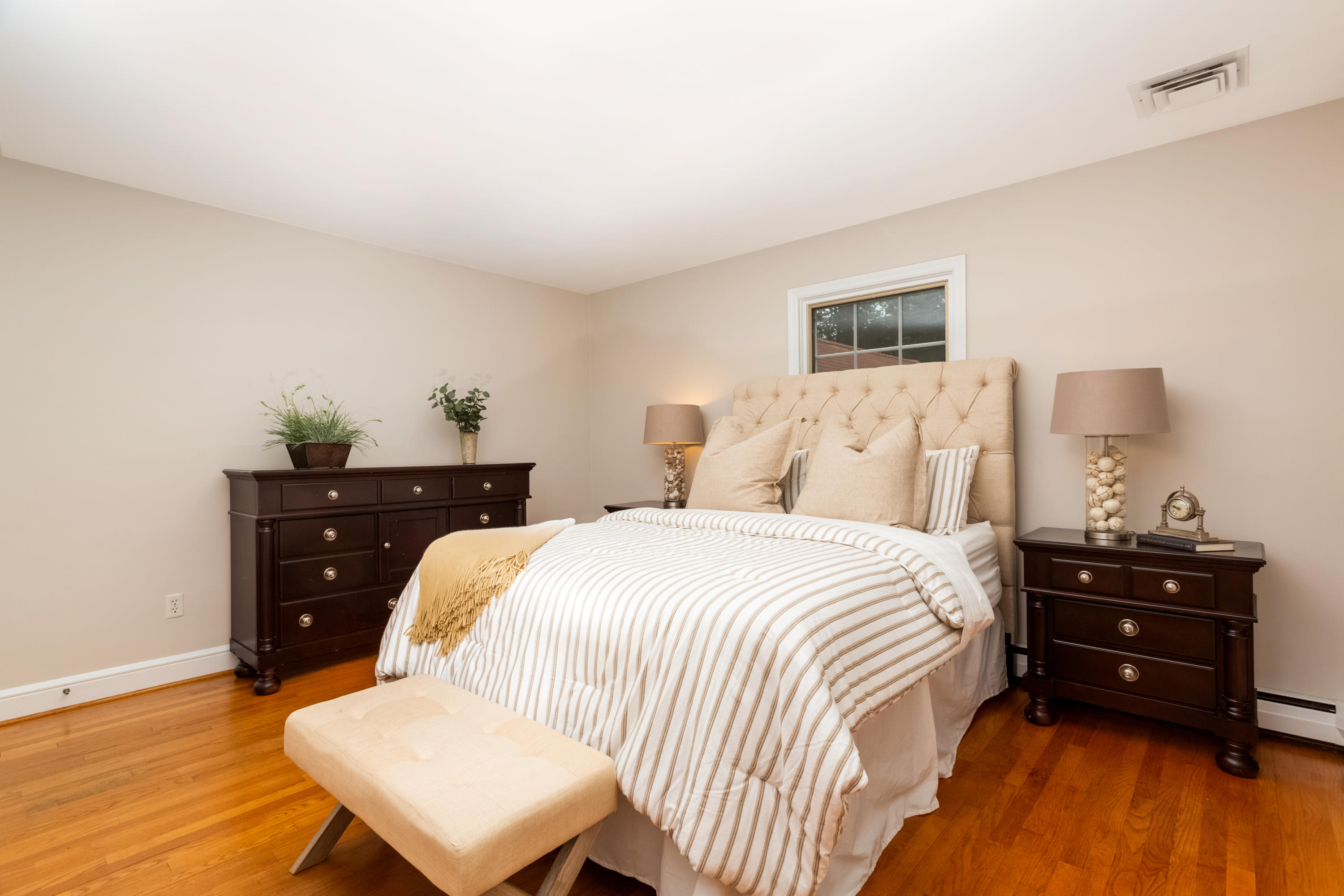 36 Locust Hill Road Darien, CT 06820 - Photo 28 of 40 a bedroom with a bed and wooden floor