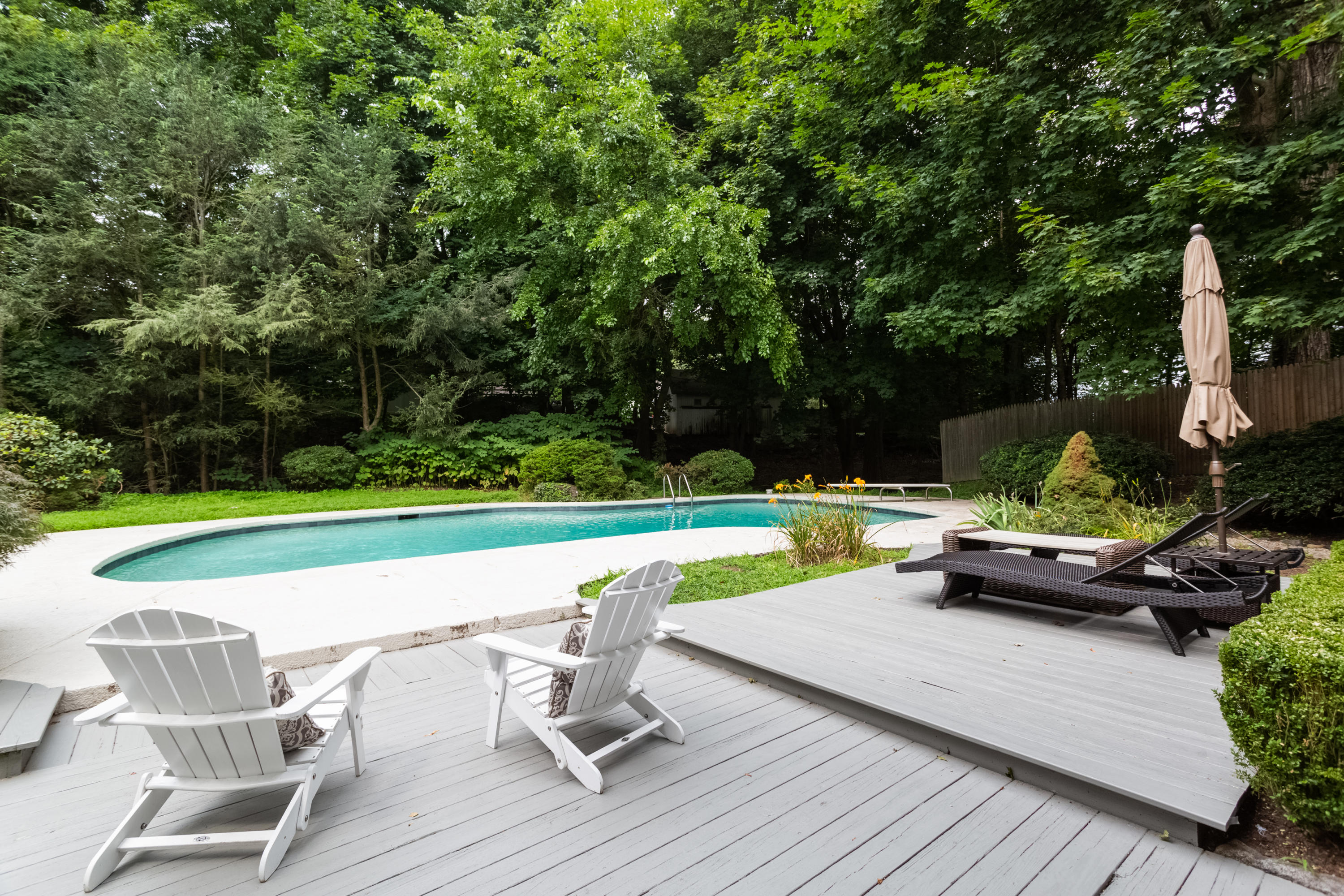 36 Locust Hill Road Darien, CT 06820 - Photo 31 of 40 a view of a swimming pool with a patio