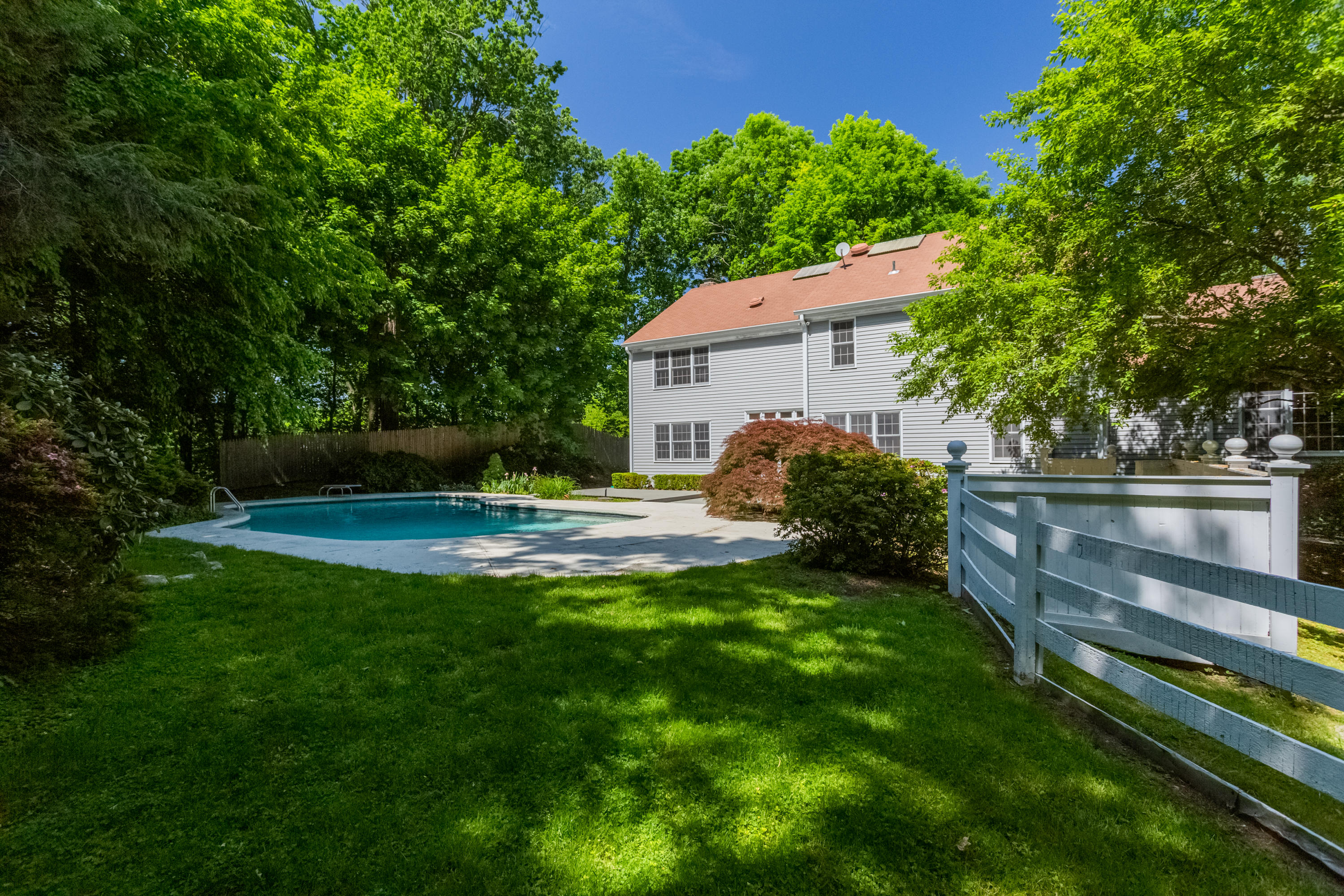 36 Locust Hill Road Darien, CT 06820 - Photo 33 of 40 a view of a house with backyard and sitting area