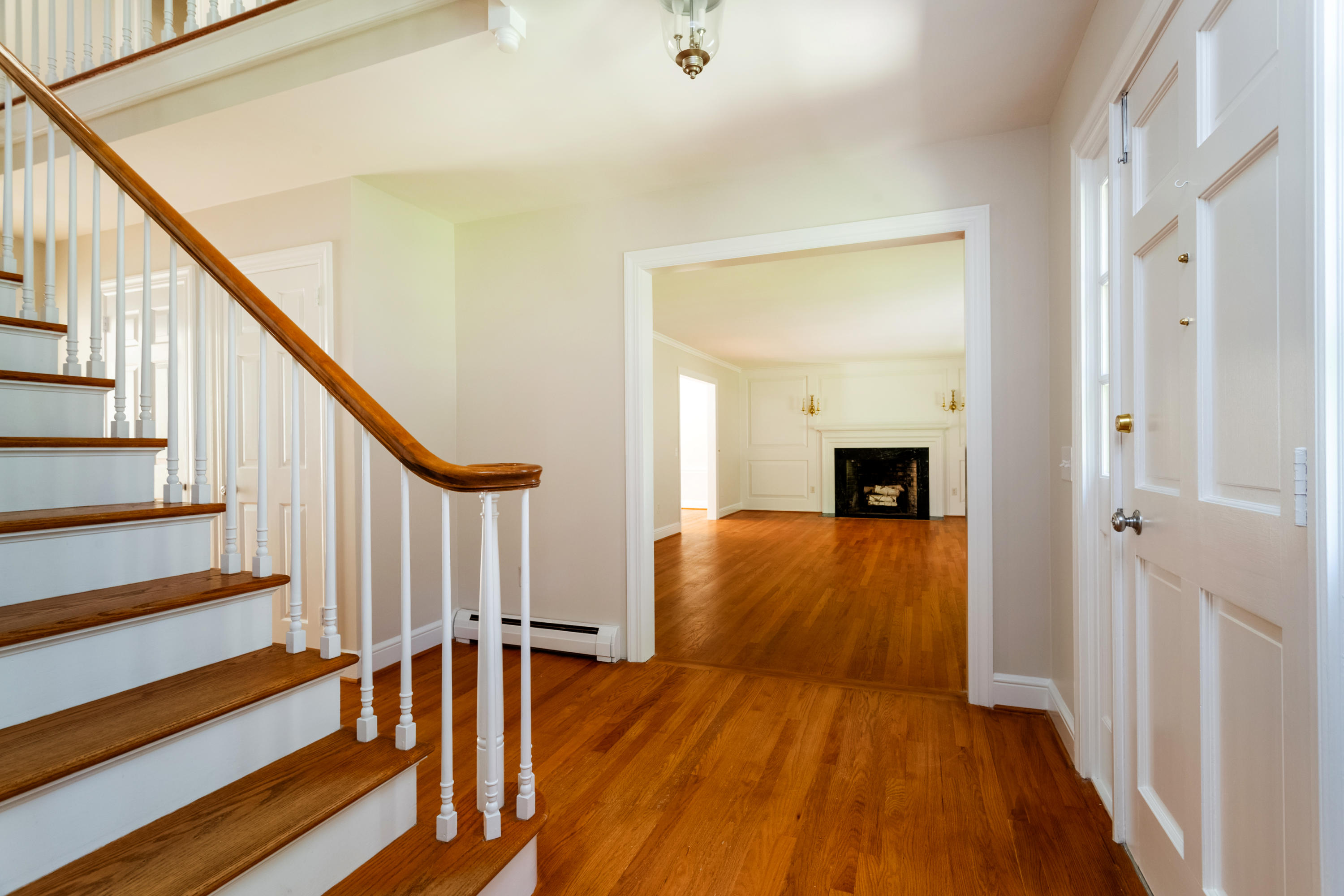 36 Locust Hill Road Darien, CT 06820 - Photo 5 of 40 a view of a room with wooden floor and stairs