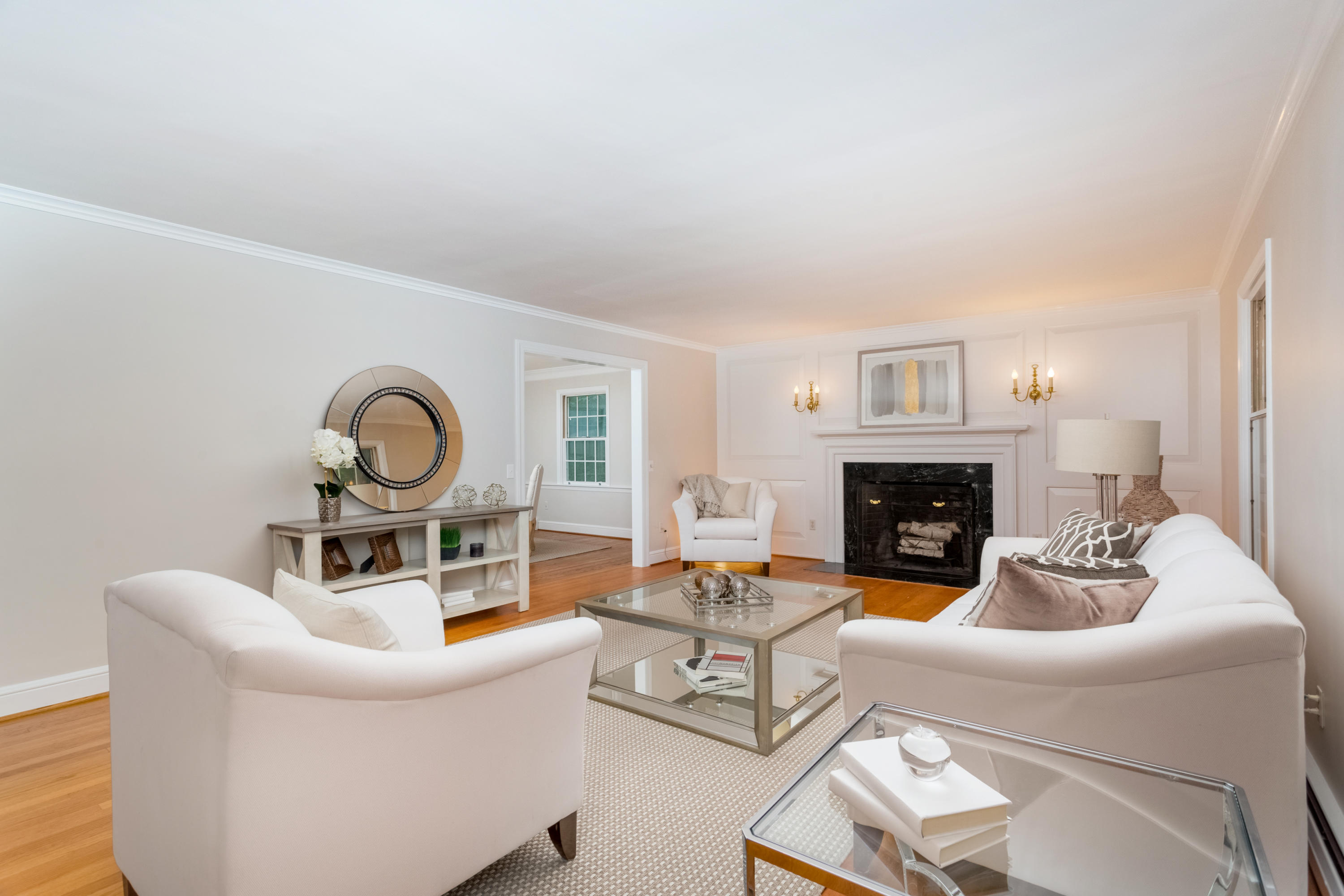 36 Locust Hill Road Darien, CT 06820 - Photo 7 of 40 a living room with furniture a fireplace and a window
