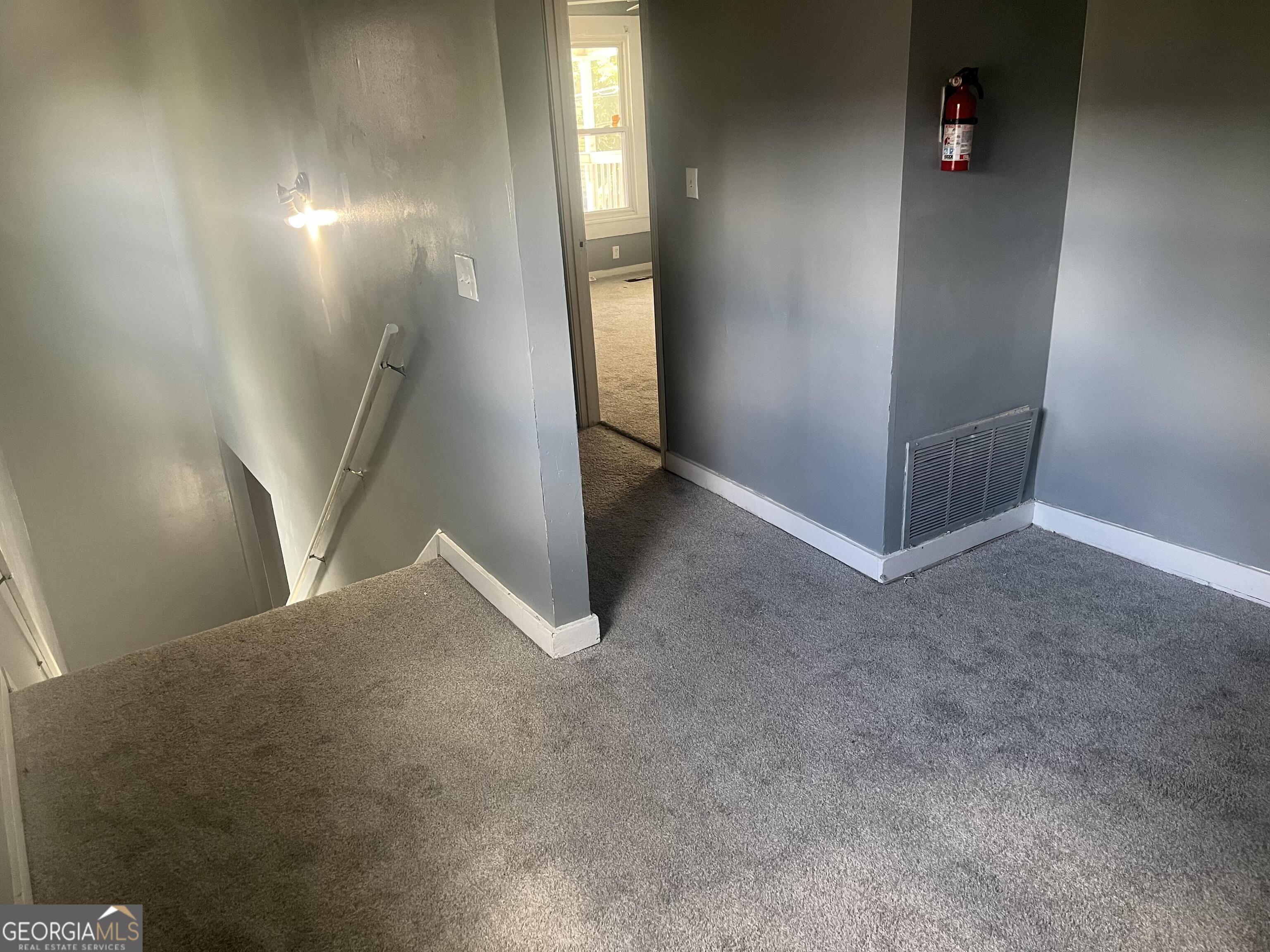 821 Beckwith Street Southwest Atlanta, GA 30314 - Photo 15 of 16 an empty room with windows