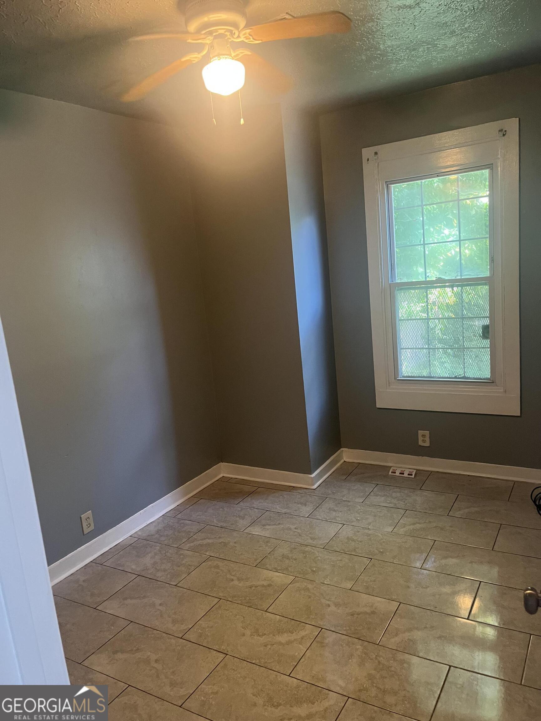 821 Beckwith Street Southwest Atlanta, GA 30314 - Photo 16 of 16 an empty room with windows